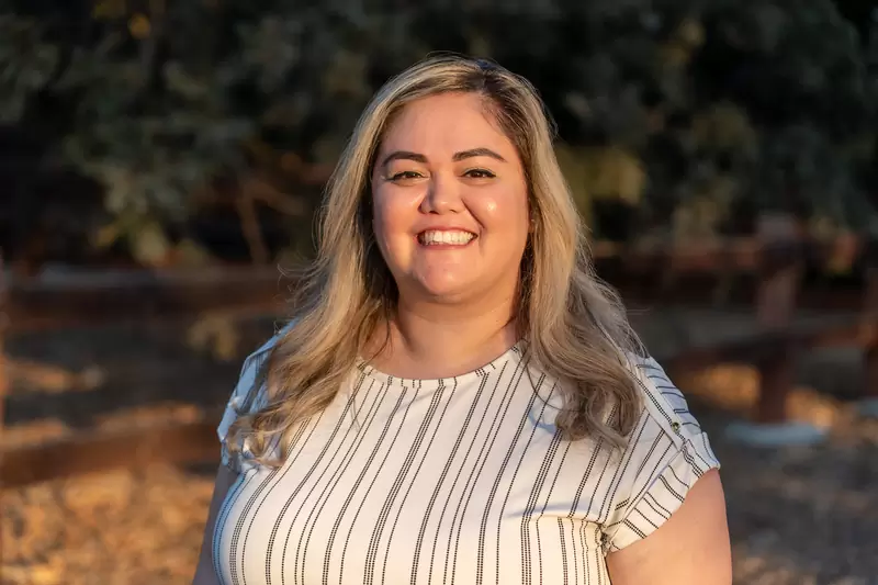 Outdoor professional headshot photographed in warm afternoon light