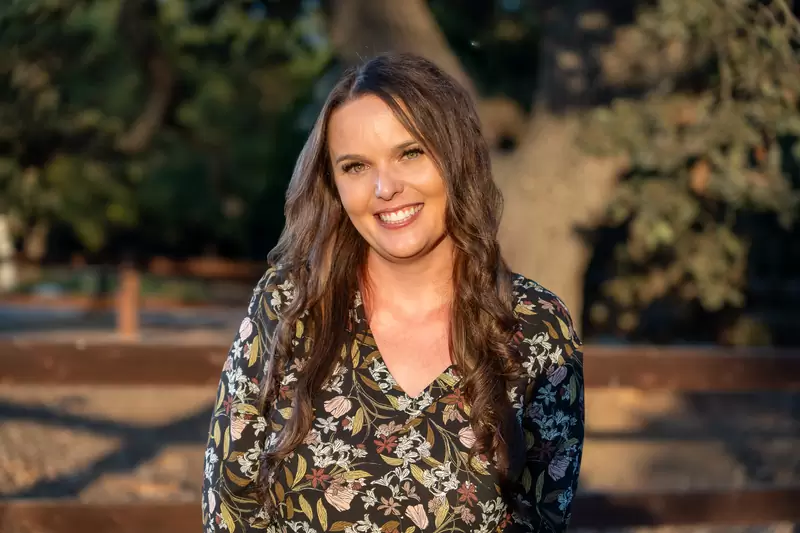 Relaxed professional headshot photographed on location in a park