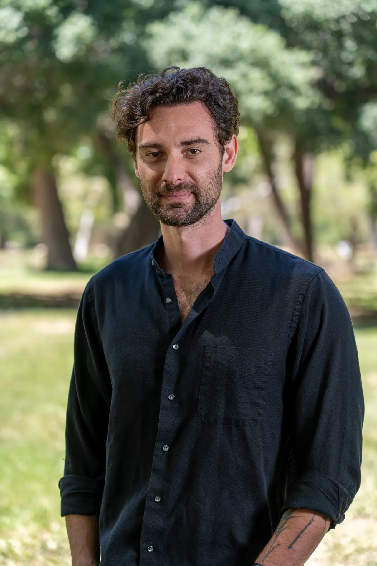 Relaxed outdoor headshot of a man photographed in a Los Angeles park