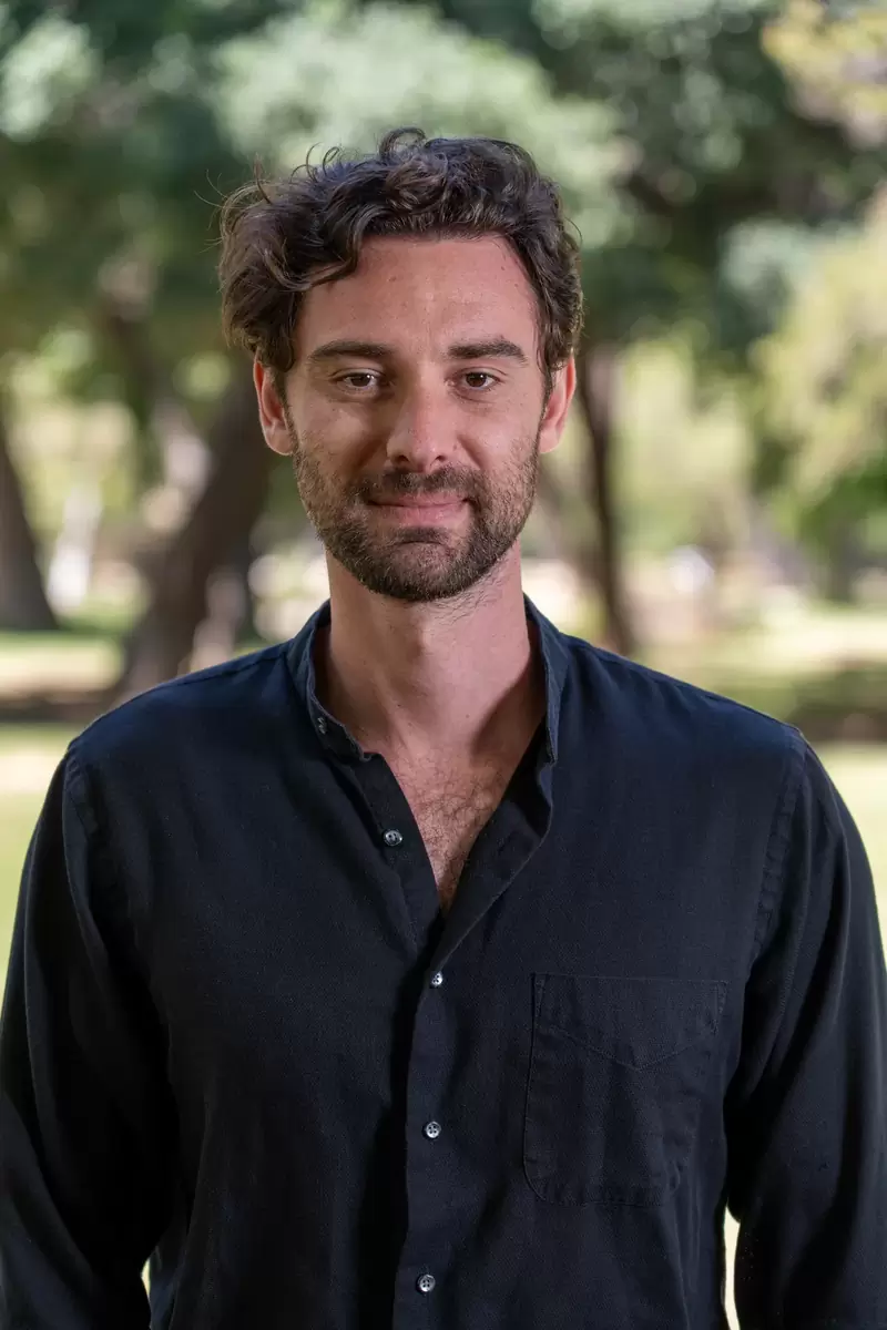 Professional headshot of a man photographed outdoors in a Los Angeles park