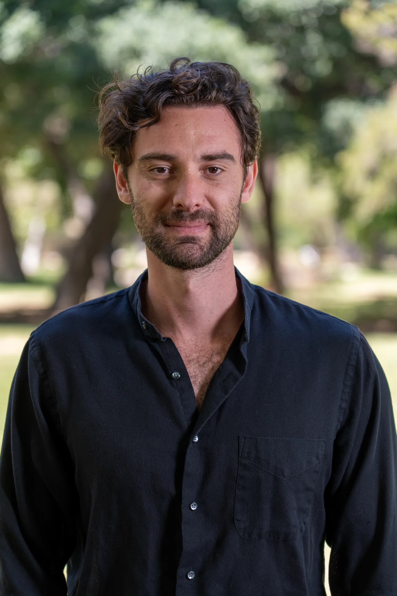 Professional headshot of a man photographed outdoors in a Los Angeles park
